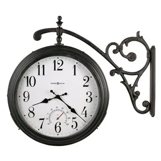 Black vintage-style wall-mounted clock with decorative metal bracket and white clock face showing the time 7:22.