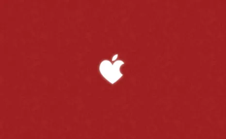 A red background with a white heart with a bite out of it similar to the Apple logo.